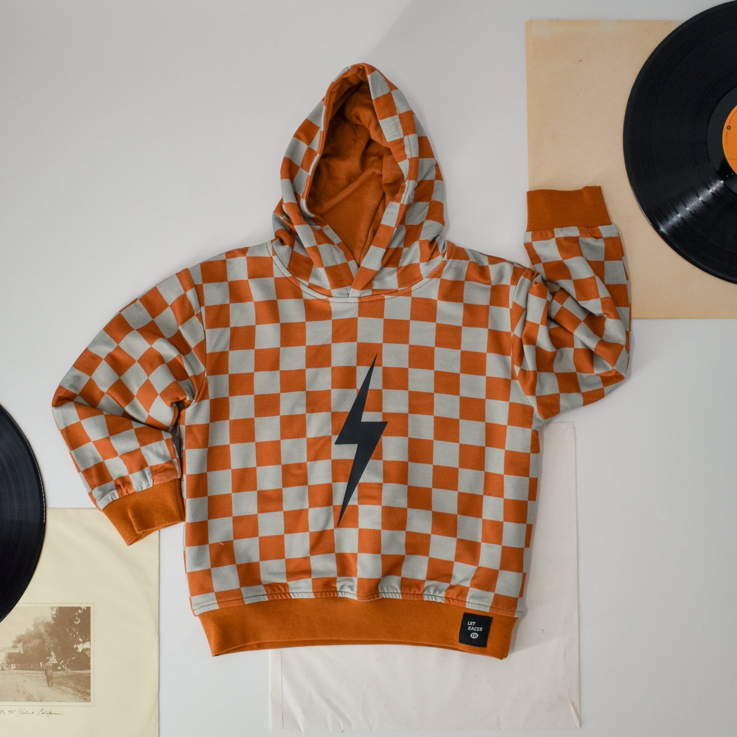THE CHECKERED SPARK HOODIE - RUST
