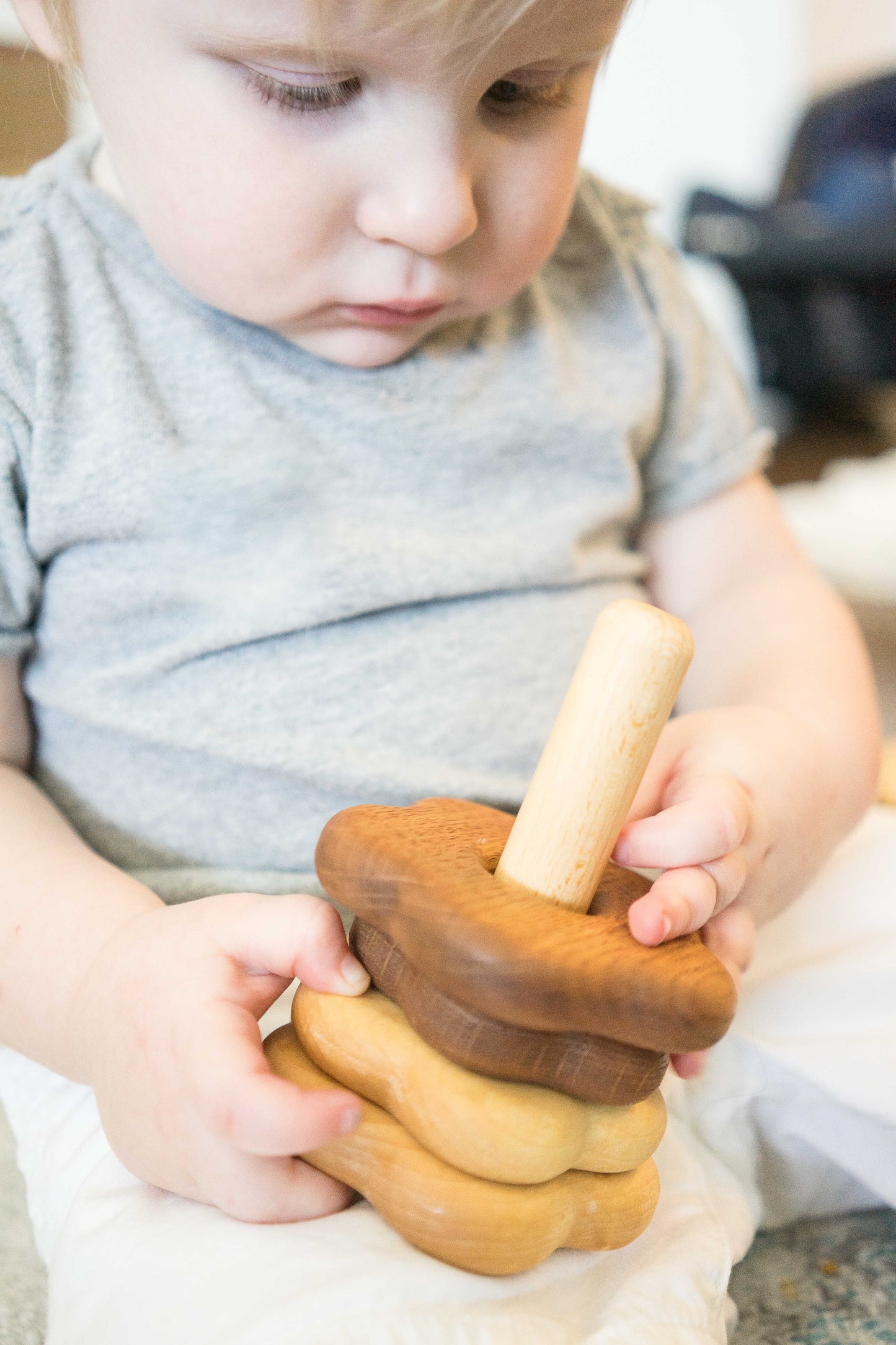 Wooden stacking toy in flower shape from 2 types of wood